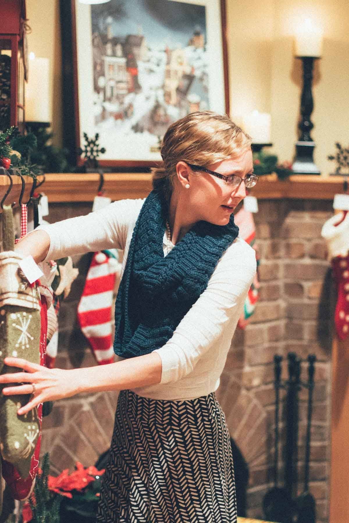 Woman reaching into a stocking.