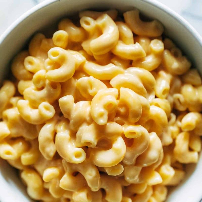 Mac and cheese piled high in a bowl.