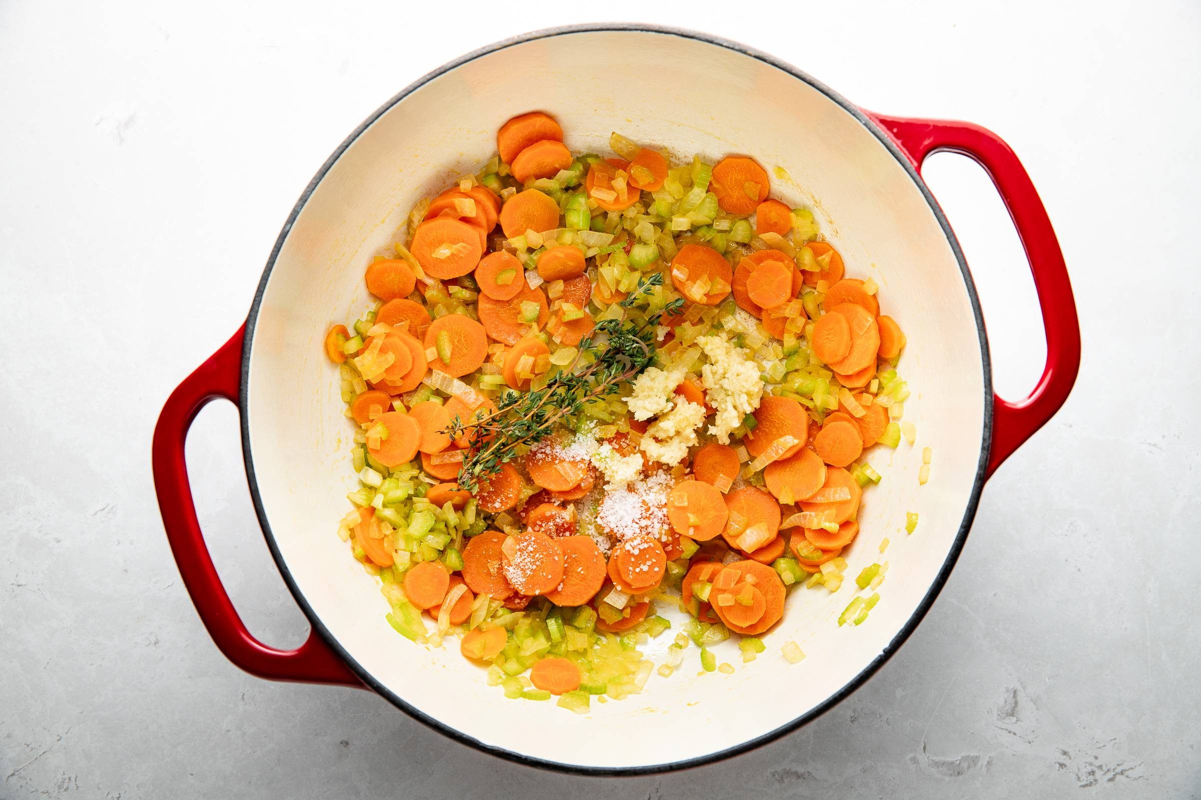 Veggies and aromatics in a dutch oven.