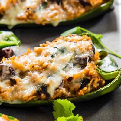Queso Stuffed Poblanos on a sheet pan.