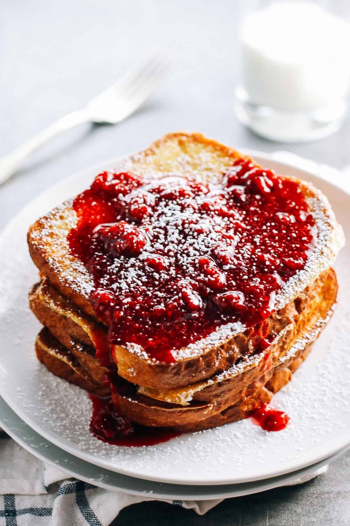 Eggnog French Toast with raspberry sauce.