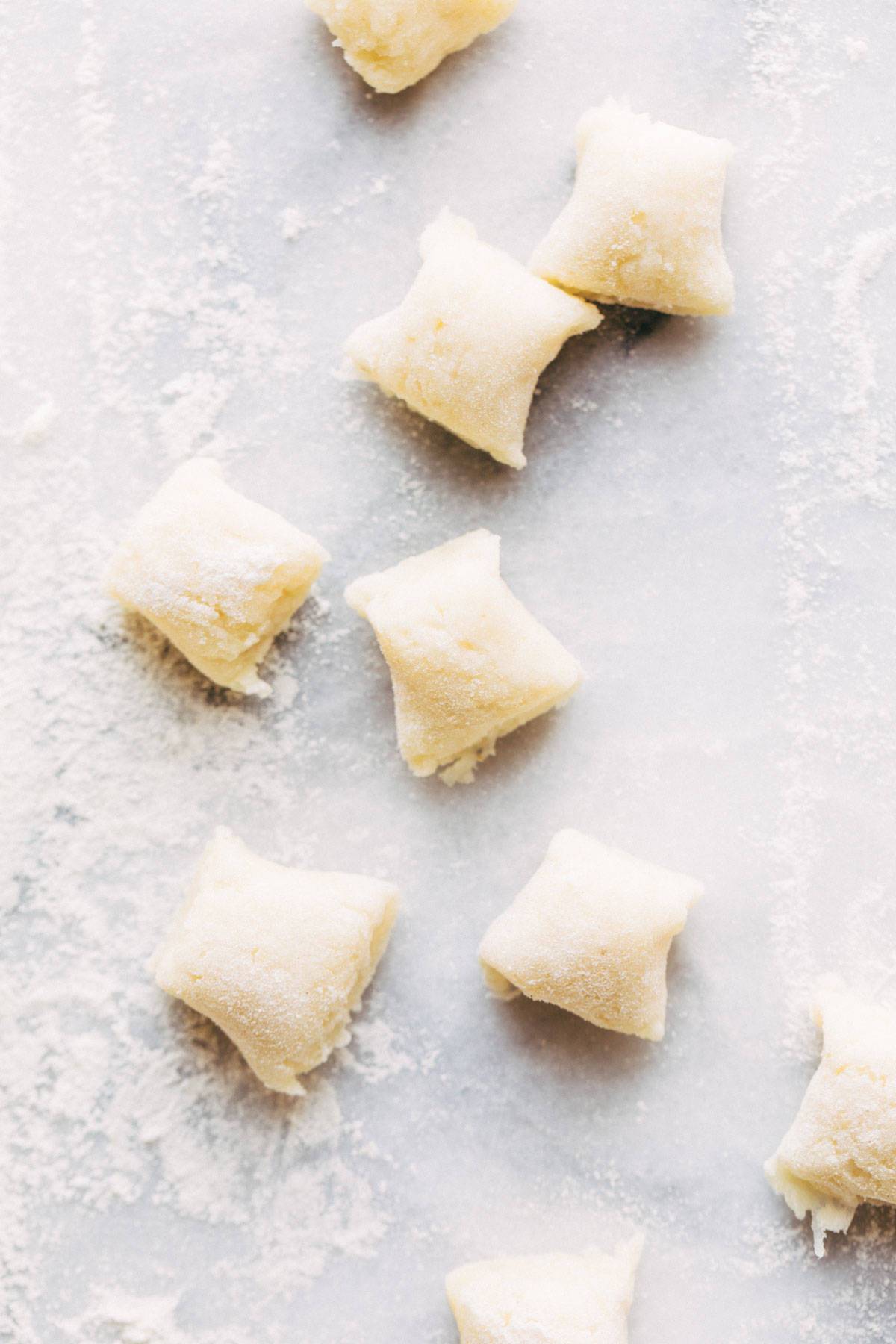 Pieces of gnocchi coated in flour.