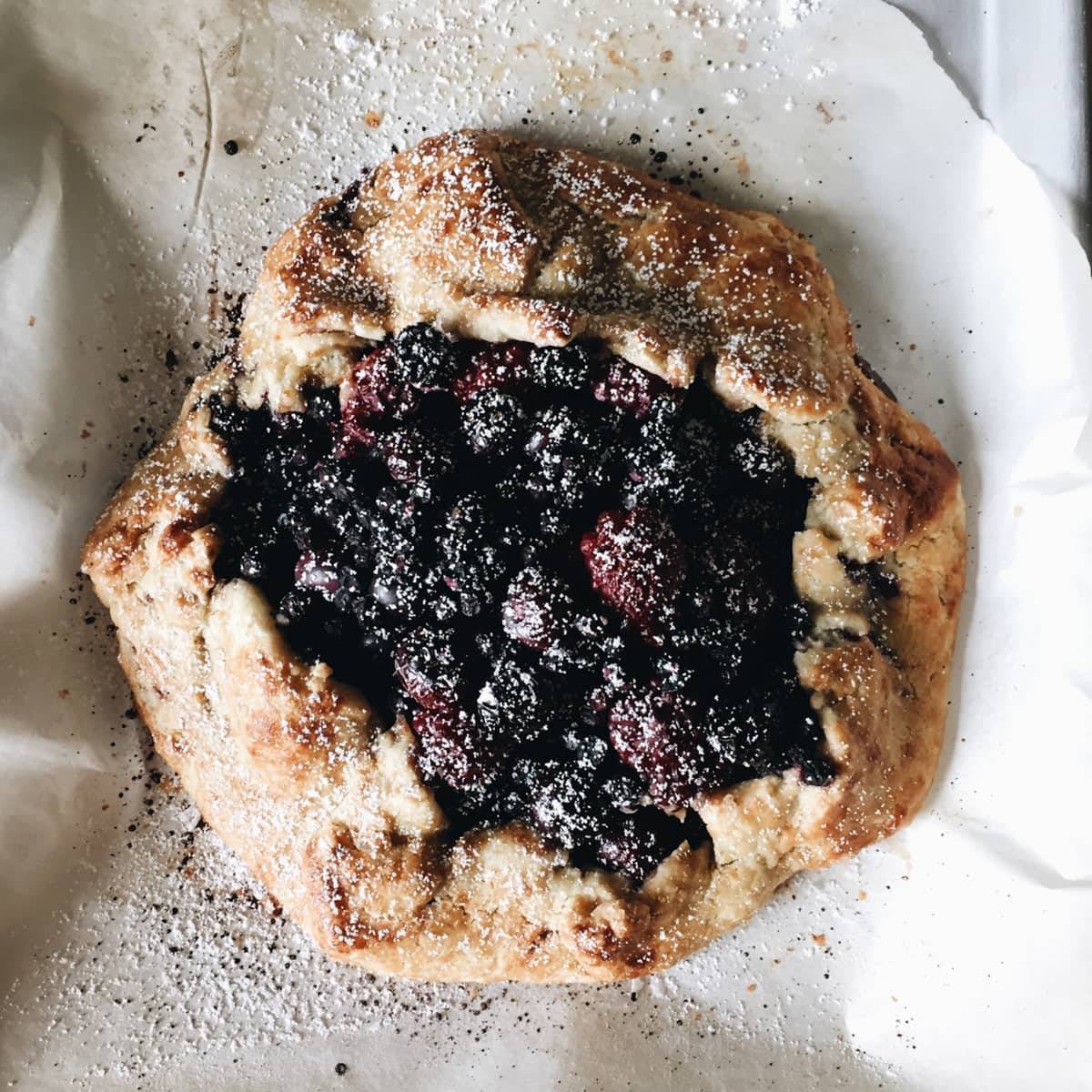 food on parchment paper dusted with powdered sugar