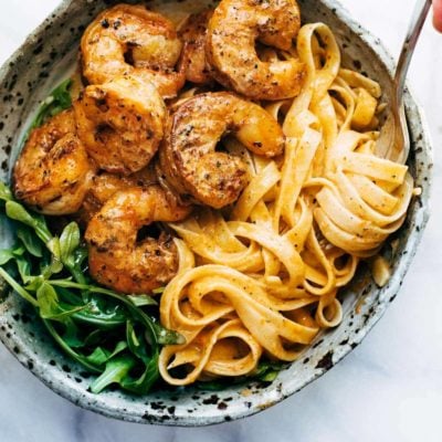 Red Pepper Fettuccine in a bowl with shrimp.